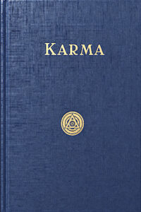 Blue book titled Karma with Yogi Publication Society logo.